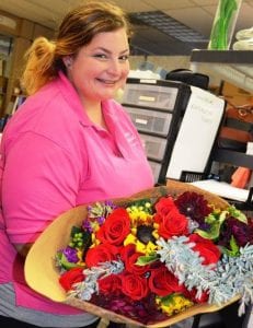 Periodic Facebook posts showing happy employees, such as Alanna Drzyzga, are just one way that Monday Morning Flowers and Balloon Company shows the human side of the business.