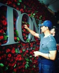 Raul Àvila sets up the rose wall in preparation for the 2016 Tony Awards.