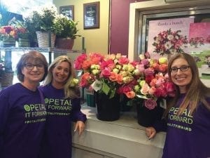 Donna Dolgoff, Andrea Luts and Beth Herman of Palace Florists wore branded T-shirts for their Washington, D.C. Petal It Forward event in 2015. SAF supplies members with the Petal It Forward logo and other materials atsafnow.tempurl.host/petalitforward.