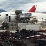 cargo plane on a tarmac being loaded