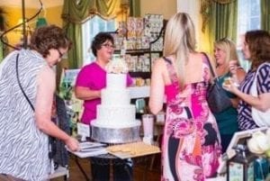 Guests at Jennifer Pryor’s annual “engagement party” for brides-to-be and wedding vendors visit in her gift shop. Pryor encourages clients to set up a registry with her.