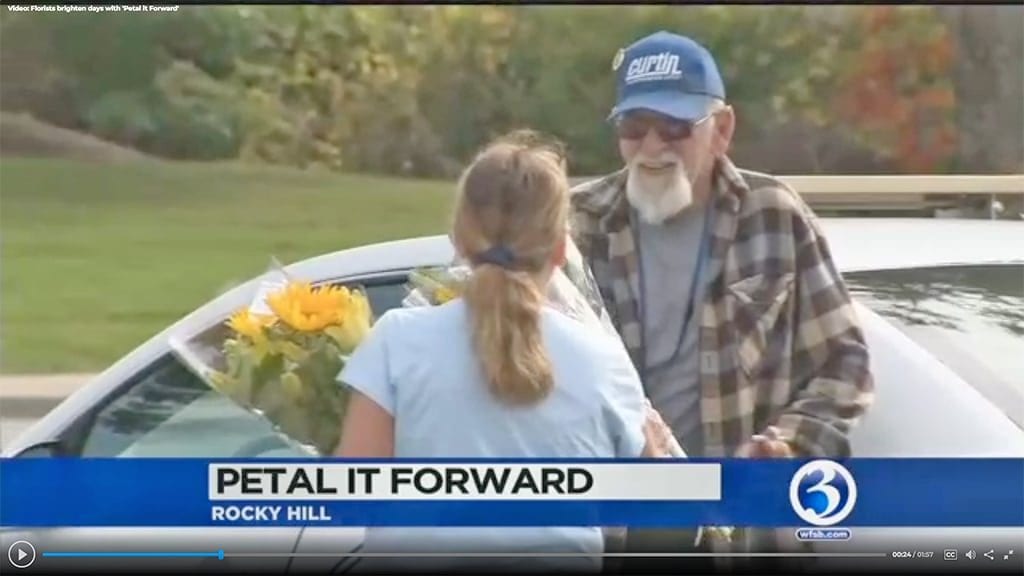 Reporter Matthew Campbell tagged along in Rocky Hill, Connecticut, with retailer The Root System’s “surprise squad,” catching recipients’ responses to Petal It Forward on camera.