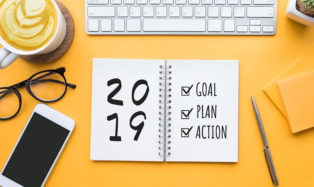 2019 new year goal,plan,action text on notepad with office accessories.Business motivation,inspiration concepts