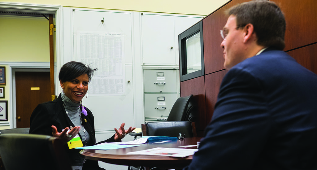 Stacie Lee Banks of Lee’s Flower and Card Shop, Inc. in Washington, D.C., discusses industry issues with a member of the staff of Congresswoman Eleanor Holmes Norton.