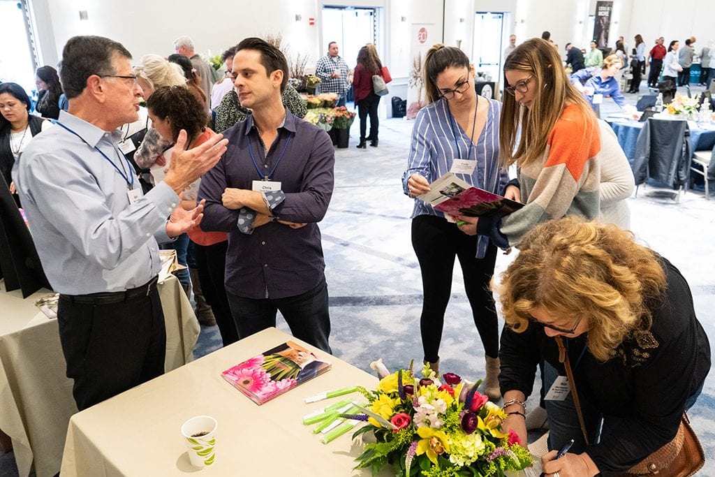 During breaks, attendees had time to visit the vendor stations and talk about new products.